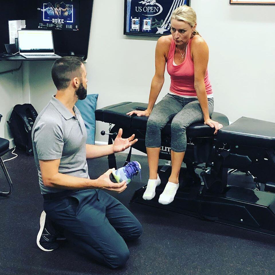 Jeff Vajay assessing patient foot injury
