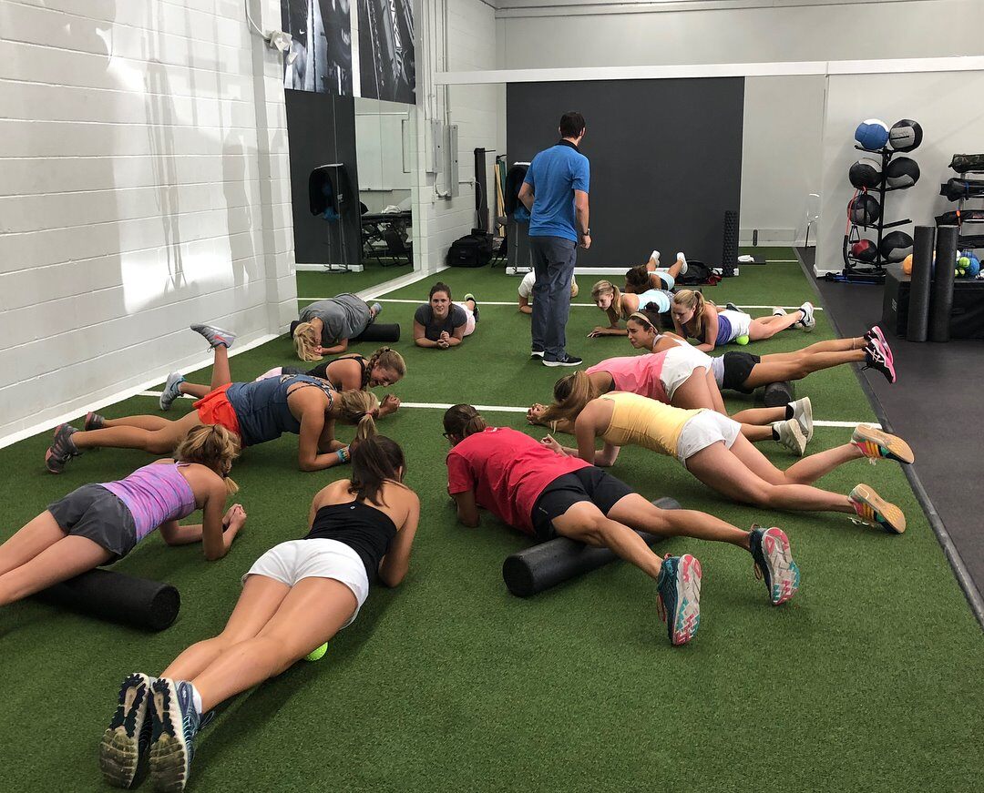 PT and Owner Jeff Vajay group foam rolling